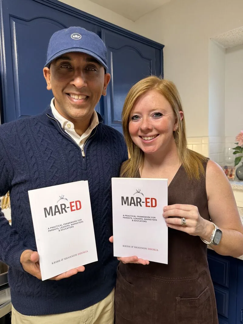 Krish and Shannon Dhokia holding copies of Mar-Ed