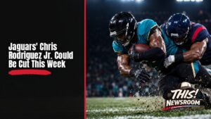 Jacksonville Jaguars running back Chris Rodriguez Jr. carrying the ball in a stadium during an NFL game