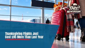 Busy airport terminal with departures board and travelers rolling luggage, showing holiday travel prices rising