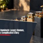 Slate and sand-colored scale model of houses stacked as a bar chart, illustrating the luxury housing market