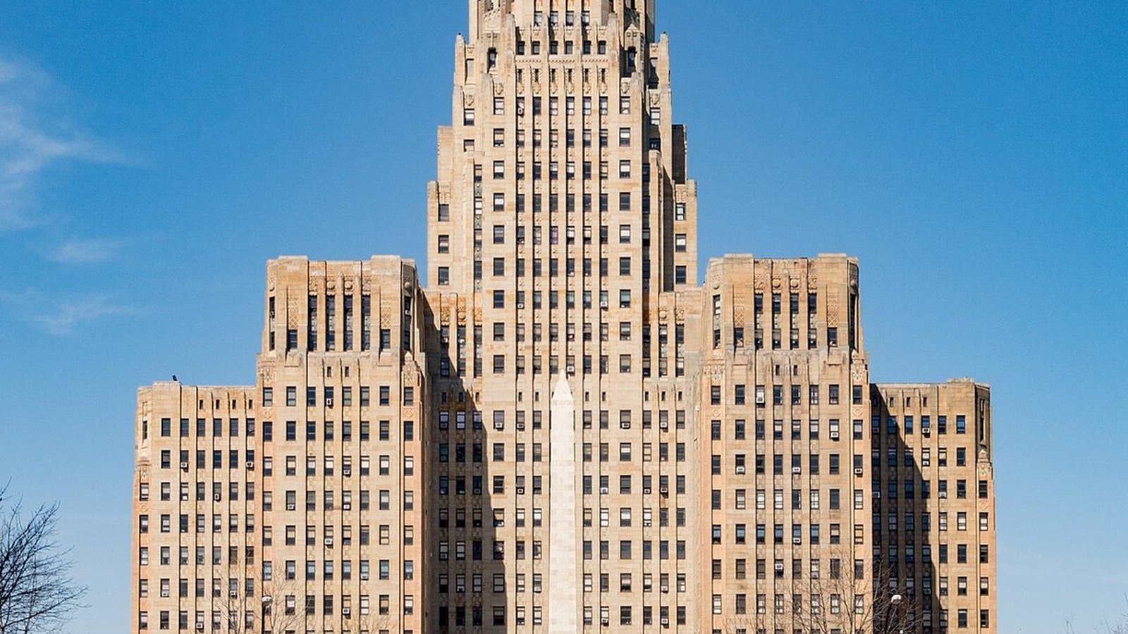 Buffalo City Hall's ivory Art Deco tower rising against a deep blue autumn sky in upstate New York