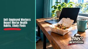 Home office desk with a laptop and a half-eaten takeout meal, illustrating the self-employed health gap